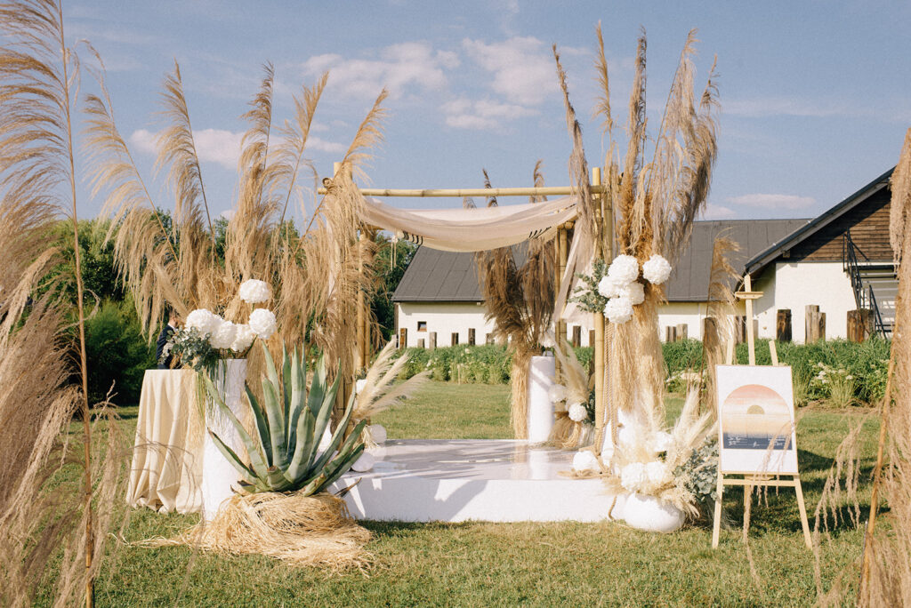 a wedding ceremony with a white and brown setting