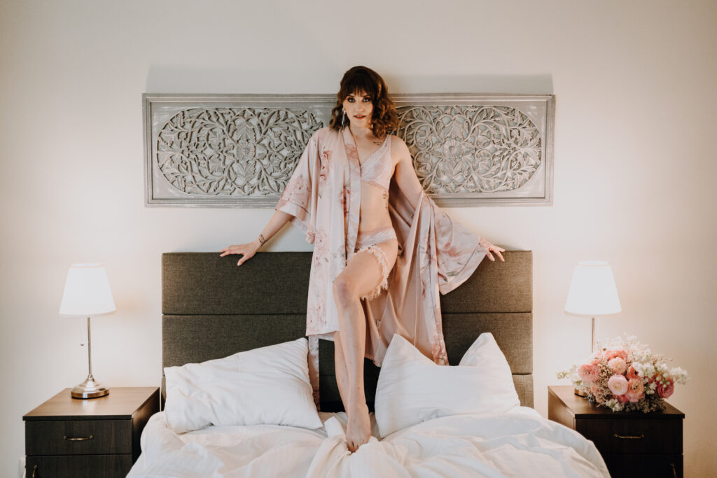 a woman standing on a bed