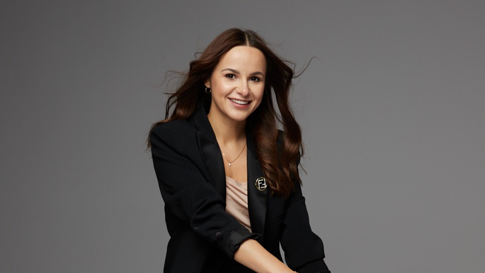 a woman in a black suit