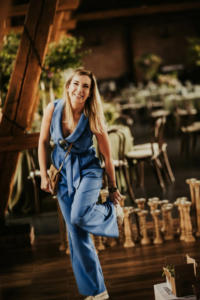 a woman in a blue jumpsuit